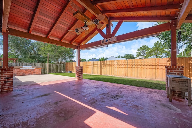 3402 Santa Catalina Ct, Katy, TX 77450 - fenced backyard featuring a patio area, ceiling fan, and exterior kitchen