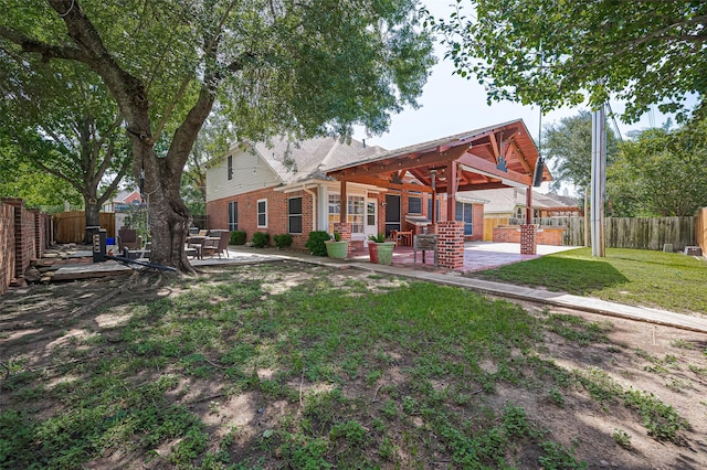 3402 Santa Catalina Ct, Katy, TX 77450 - back of property with a patio, brick siding, and a fenced backyard