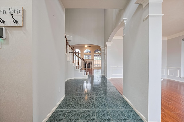 3402 Santa Catalina Ct, Katy, TX 77450 - hall with arched walkways, ornate columns, and stairs