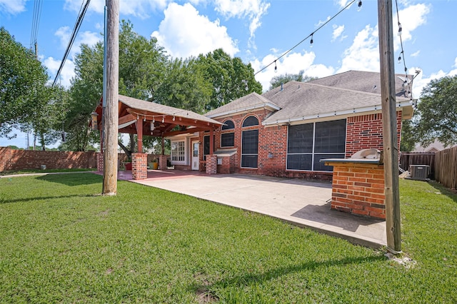 3402 Santa Catalina Ct, Katy, TX 77450 - back of house with a patio area, a fenced backyard, roof with shingles, and brick siding
