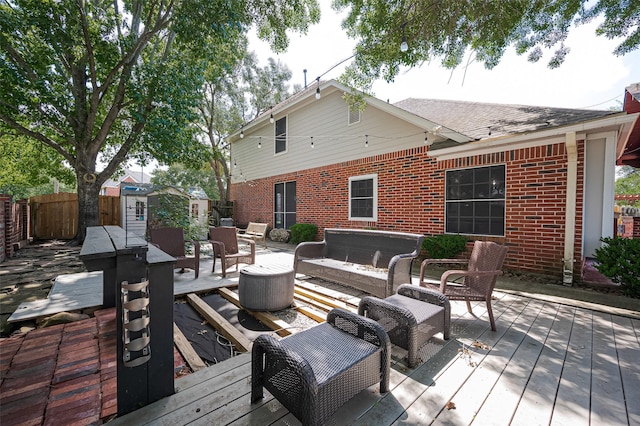 3402 Santa Catalina Ct, Katy, TX 77450 - deck with an outdoor hangout area, a fenced backyard, and a shed