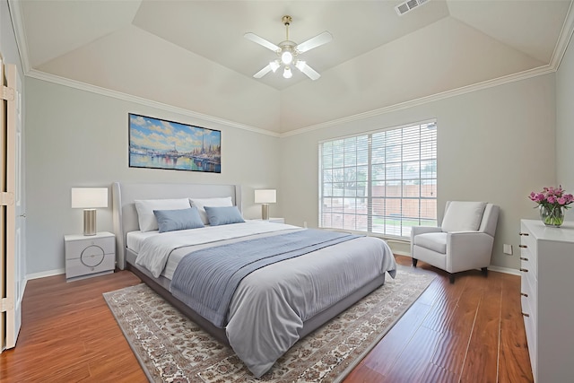3402 Santa Catalina Ct, Katy, TX 77450 - bedroom featuring a raised ceiling, wood finished floors, lofted ceiling, a ceiling fan, and ornamental molding