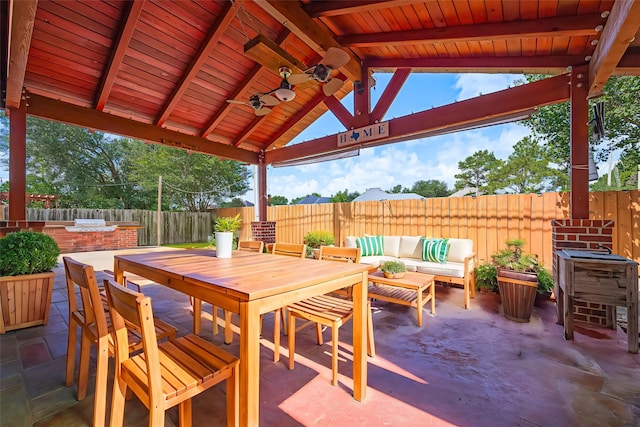 3402 Santa Catalina Ct, Katy, TX 77450 - fenced backyard with a patio area, an outdoor living space, outdoor dining area, and ceiling fan