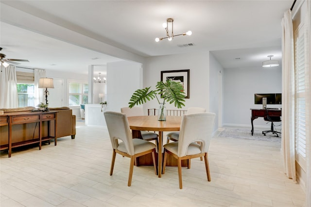 2510 Trailside Ct, Sugar Land, TX 77479 - dining space with a chandelier, a desk, ceiling fan, and light wood-style flooring