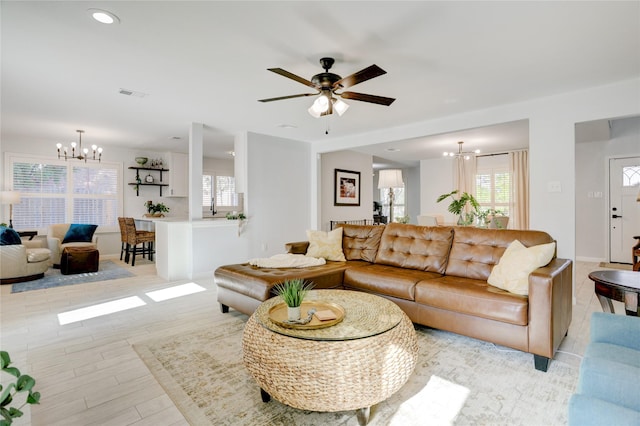 2510 Trailside Ct, Sugar Land, TX 77479 - living area with a chandelier, plenty of natural light, light wood-style floors, and recessed lighting