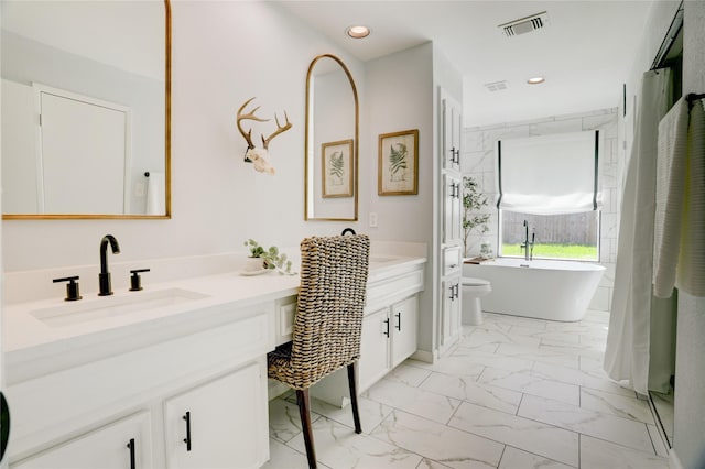 2510 Trailside Ct, Sugar Land, TX 77479 - full bathroom featuring marble finish flooring, vanity, a freestanding bath, and recessed lighting