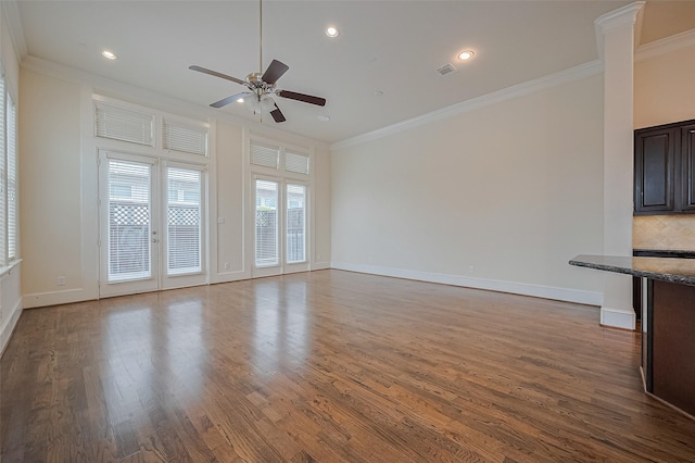 1035 E 28th St, Houston, TX 77009 - unfurnished living room with crown molding, ceiling fan, dark wood-type flooring, and recessed lighting