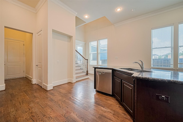 1035 E 28th St, Houston, TX 77009 - kitchen with dishwasher, ornamental molding, light wood finished floors, dark brown cabinets, and stone countertops