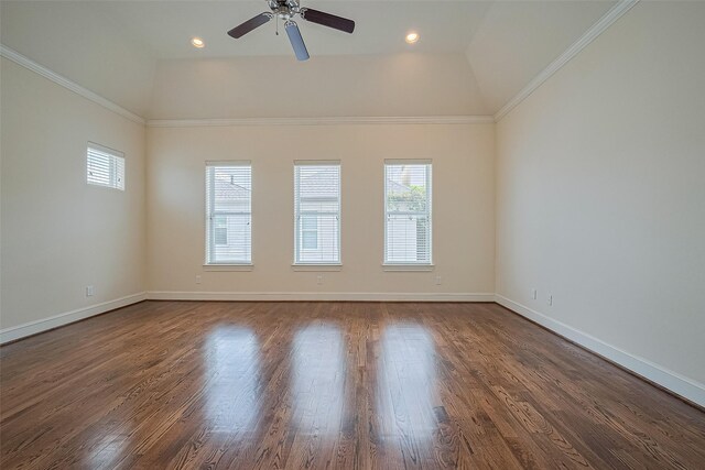 1035 E 28th St, Houston, TX 77009 - unfurnished room with plenty of natural light, a ceiling fan, vaulted ceiling, dark wood-style floors, and ornamental molding