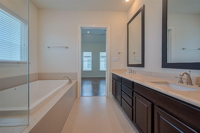 1035 E 28th St, Houston, TX 77009 - full bathroom with double vanity, tile patterned flooring, a bath, and recessed lighting