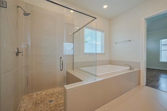 1035 E 28th St, Houston, TX 77009 - bathroom with a shower stall, a garden tub, tile patterned flooring, and recessed lighting