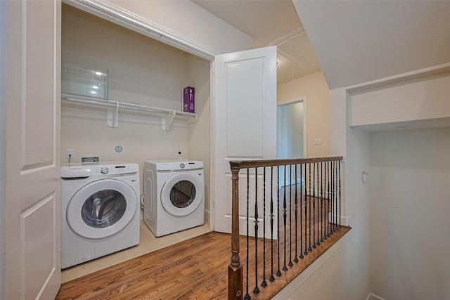 1035 E 28th St, Houston, TX 77009 - laundry area featuring washing machine and dryer, attic access, and wood finished floors