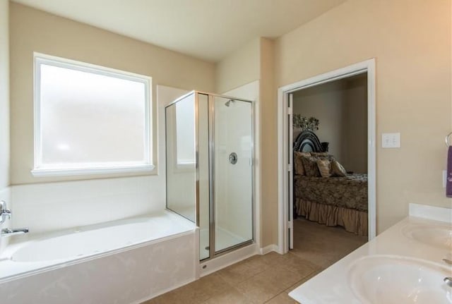 8615 Debbie Terrace Dr, Cypress, TX 77433 - bathroom with ensuite bathroom, a bath, a stall shower, and tile patterned floors