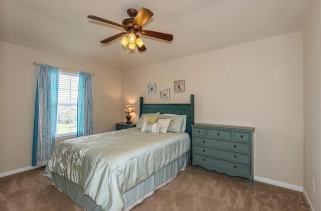 8615 Debbie Terrace Dr, Cypress, TX 77433 - carpeted bedroom with baseboards and ceiling fan