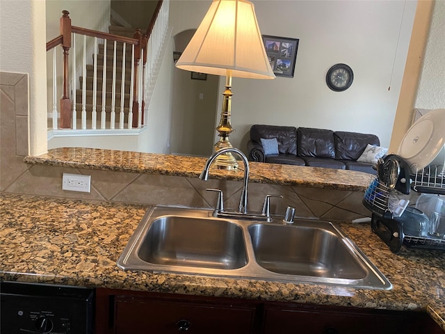 8615 Debbie Terrace Dr, Cypress, TX 77433 - kitchen view of dishwashing machine and dark stone countertops