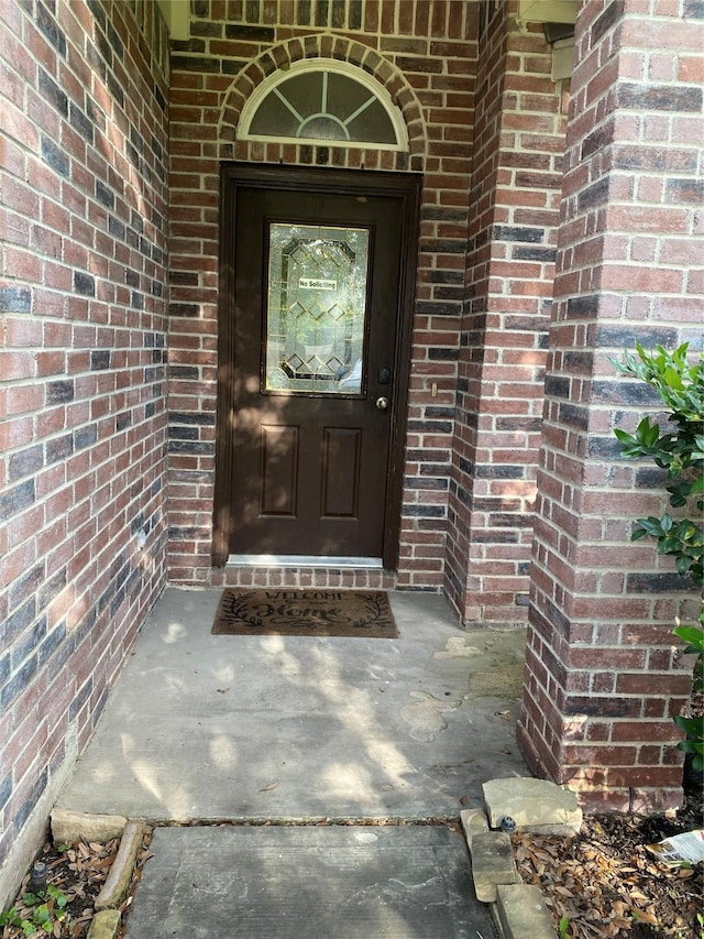 8615 Debbie Terrace Dr, Cypress, TX 77433 - view of exterior entry featuring brick siding