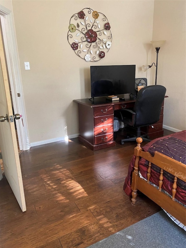 8615 Debbie Terrace Dr, Cypress, TX 77433 - bedroom featuring dark wood finished floors and a desk