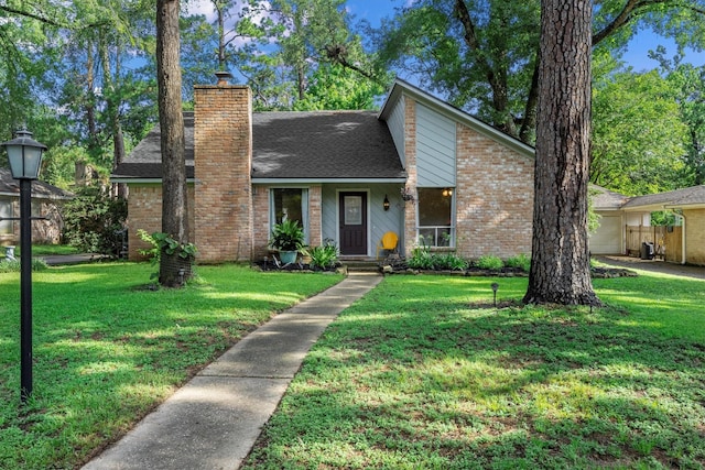 4638 Deer Point Dr, Spring, TX 77389 - mid-century home with a chimney, a front lawn, and brick siding