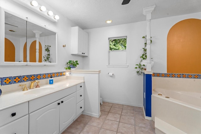 4638 Deer Point Dr, Spring, TX 77389 - full bathroom with vanity, a bath, a textured ceiling, and tile patterned flooring