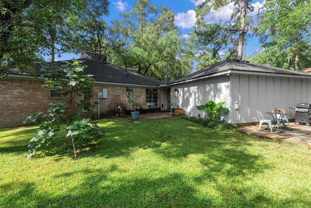 4638 Deer Point Dr, Spring, TX 77389 - rear view of property featuring a patio, a lawn, and brick siding