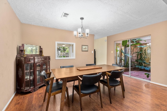 4638 Deer Point Dr, Spring, TX 77389 - dining room featuring a textured ceiling, a chandelier, and wood finished floors