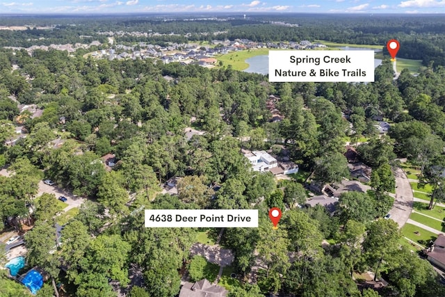 4638 Deer Point Dr, Spring, TX 77389 - drone / aerial view of a heavily wooded area and a large body of water