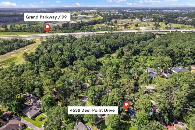 4638 Deer Point Dr, Spring, TX 77389 - aerial view of property's location featuring a tree filled landscape