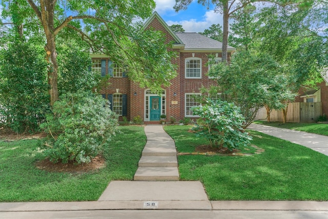 58 E Coldbrook Cir, The Woodlands, TX 77381 - view of front of home featuring brick siding and a shingled roof