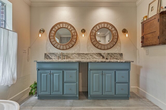 58 E Coldbrook Cir, The Woodlands, TX 77381 - bathroom featuring crown molding and double vanity