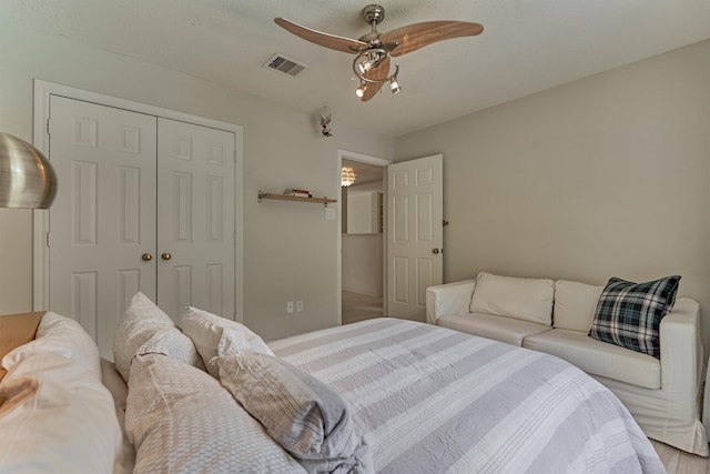 58 E Coldbrook Cir, The Woodlands, TX 77381 - bedroom with a closet and a ceiling fan