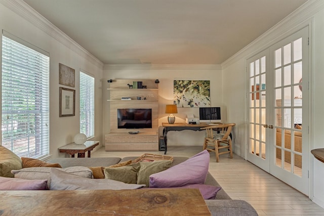 58 E Coldbrook Cir, The Woodlands, TX 77381 - living area featuring french doors, ornamental molding, and wood finished floors