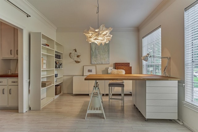 58 E Coldbrook Cir, The Woodlands, TX 77381 - dining area with a chandelier, crown molding, and light wood-type flooring