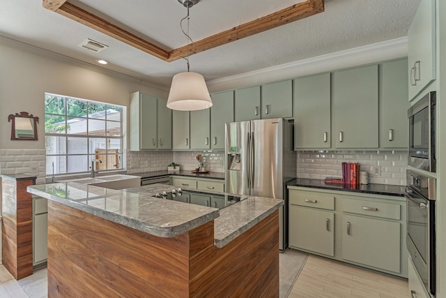 58 E Coldbrook Cir, The Woodlands, TX 77381 - kitchen featuring green cabinets, black appliances, a raised ceiling, crown molding, and tasteful backsplash