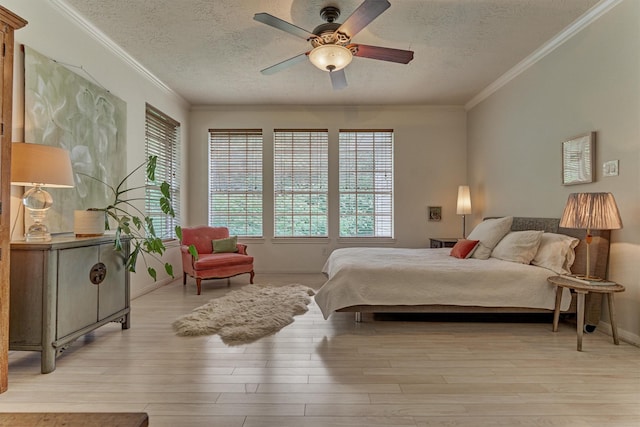 58 E Coldbrook Cir, The Woodlands, TX 77381 - bedroom featuring a textured ceiling, wood finished floors, crown molding, and ceiling fan
