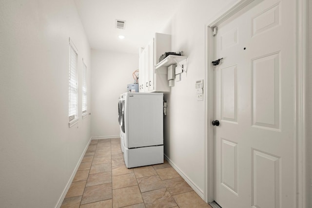 21 Panorama Dr, Conroe, TX 77304 - washroom with cabinet space, separate washer and dryer, and light stone finish flooring