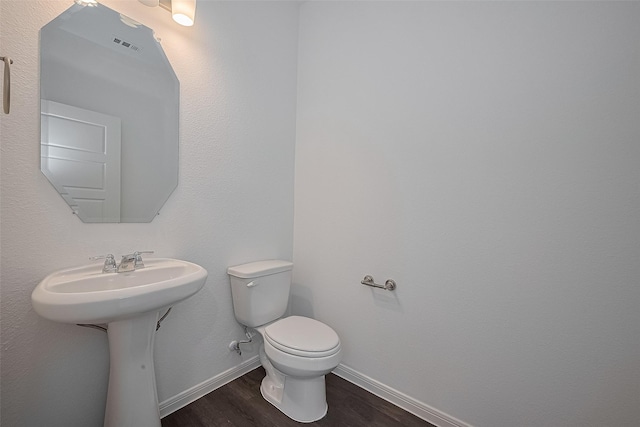 27097 Kestrel Trl, Magnolia, TX 77354 - bathroom with wood finished floors and toilet