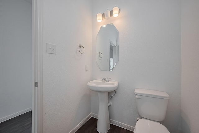 27097 Kestrel Trl, Magnolia, TX 77354 - half bathroom featuring wood finished floors and toilet
