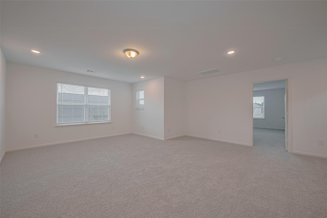 27097 Kestrel Trl, Magnolia, TX 77354 - empty room featuring light carpet and recessed lighting
