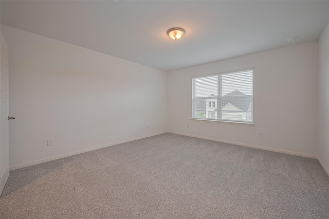 27097 Kestrel Trl, Magnolia, TX 77354 - spare room featuring light carpet and a smoke detector
