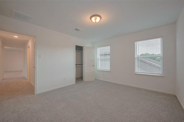 27097 Kestrel Trl, Magnolia, TX 77354 - unfurnished bedroom featuring carpet floors, a closet, and attic access