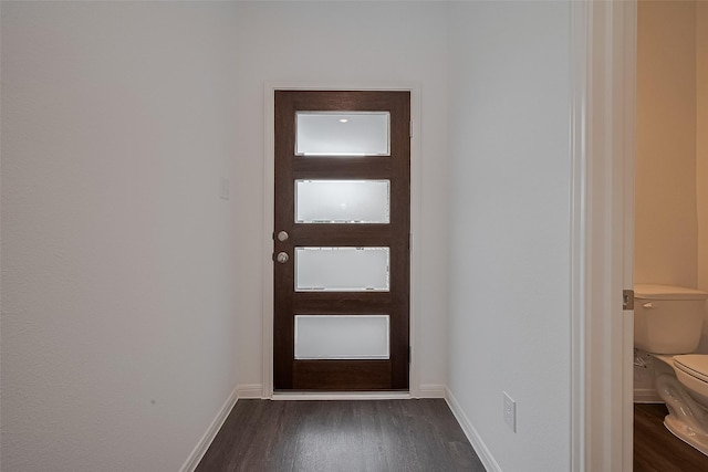 27097 Kestrel Trl, Magnolia, TX 77354 - doorway to outside with dark wood finished floors and baseboards