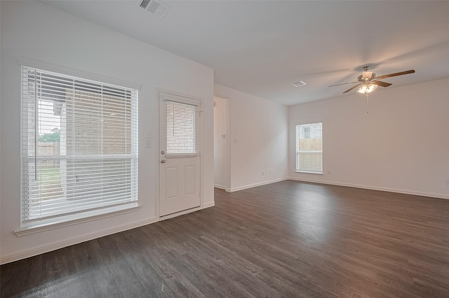 27097 Kestrel Trl, Magnolia, TX 77354 - empty room with dark wood-style flooring and a ceiling fan