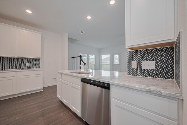 27097 Kestrel Trl, Magnolia, TX 77354 - kitchen featuring dishwasher, backsplash, white cabinetry, dark wood-type flooring, and light stone counters