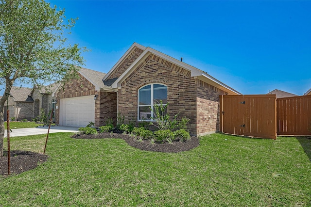 2204 Port Jackson, Texas City, TX 77568 - view of front of property with brick siding, an attached garage, concrete driveway, and a gate