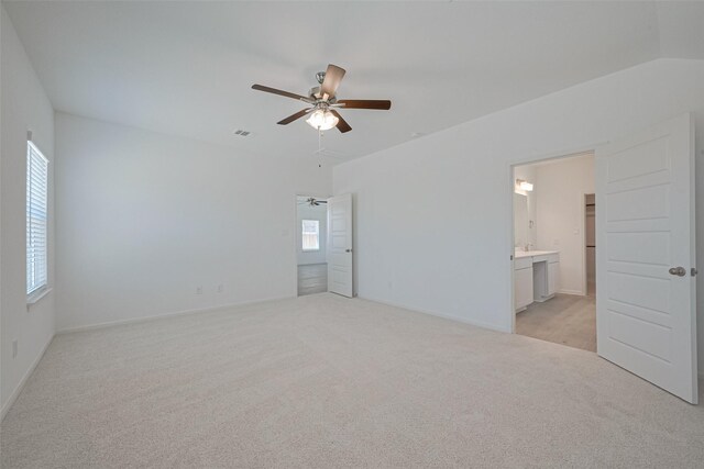 2204 Port Jackson, Texas City, TX 77568 - unfurnished bedroom with light carpet, ensuite bathroom, and ceiling fan