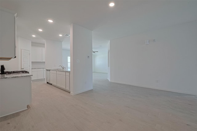 2204 Port Jackson, Texas City, TX 77568 - kitchen with stainless steel dishwasher, open floor plan, light wood-type flooring, white cabinetry, and recessed lighting