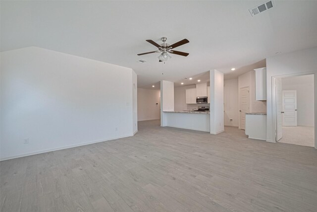 2204 Port Jackson, Texas City, TX 77568 - unfurnished living room with a ceiling fan, light wood-type flooring, and recessed lighting