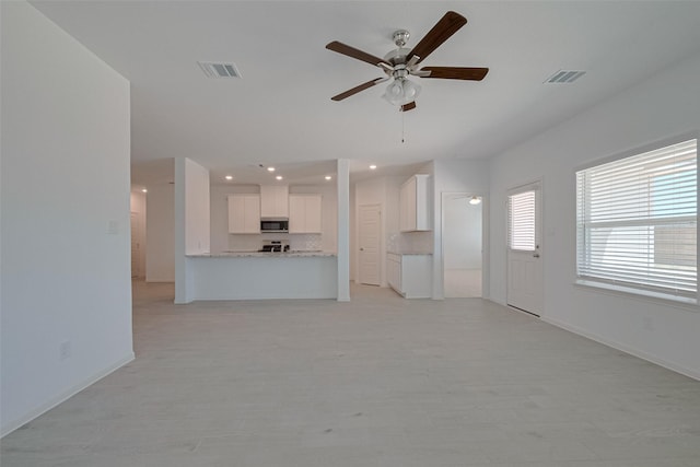 2204 Port Jackson, Texas City, TX 77568 - unfurnished living room with ceiling fan, recessed lighting, and light wood finished floors