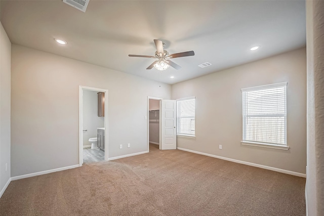 2127 Port Jackson, Texas City, TX 77568 - unfurnished bedroom with carpet, a walk in closet, connected bathroom, recessed lighting, and a ceiling fan