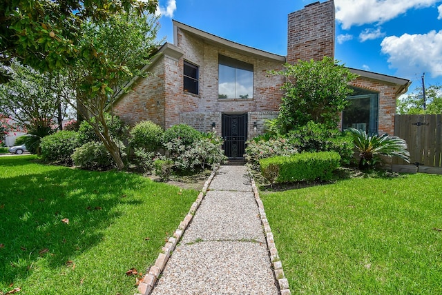 7719 Apache Plume Dr, Houston, TX 77071 - view of front of house with brick siding and a chimney